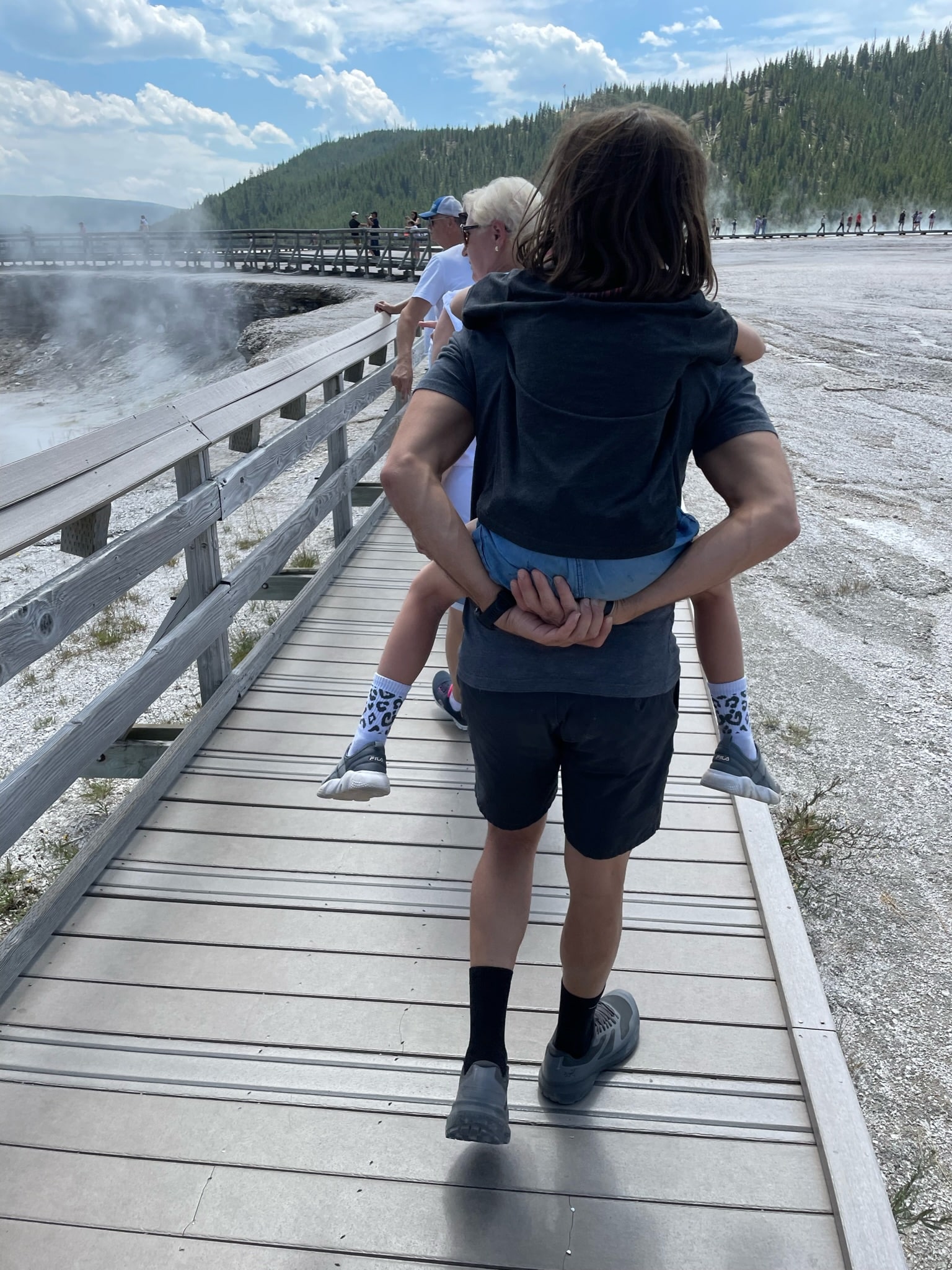 Walking on a boardwalk in Yellowstone National Park