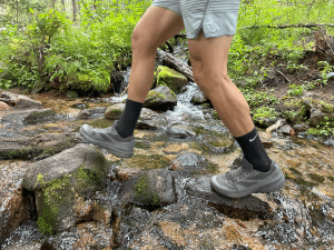 Arcteryx Norvan LD 3 GTX trail running shoe crossing a stream