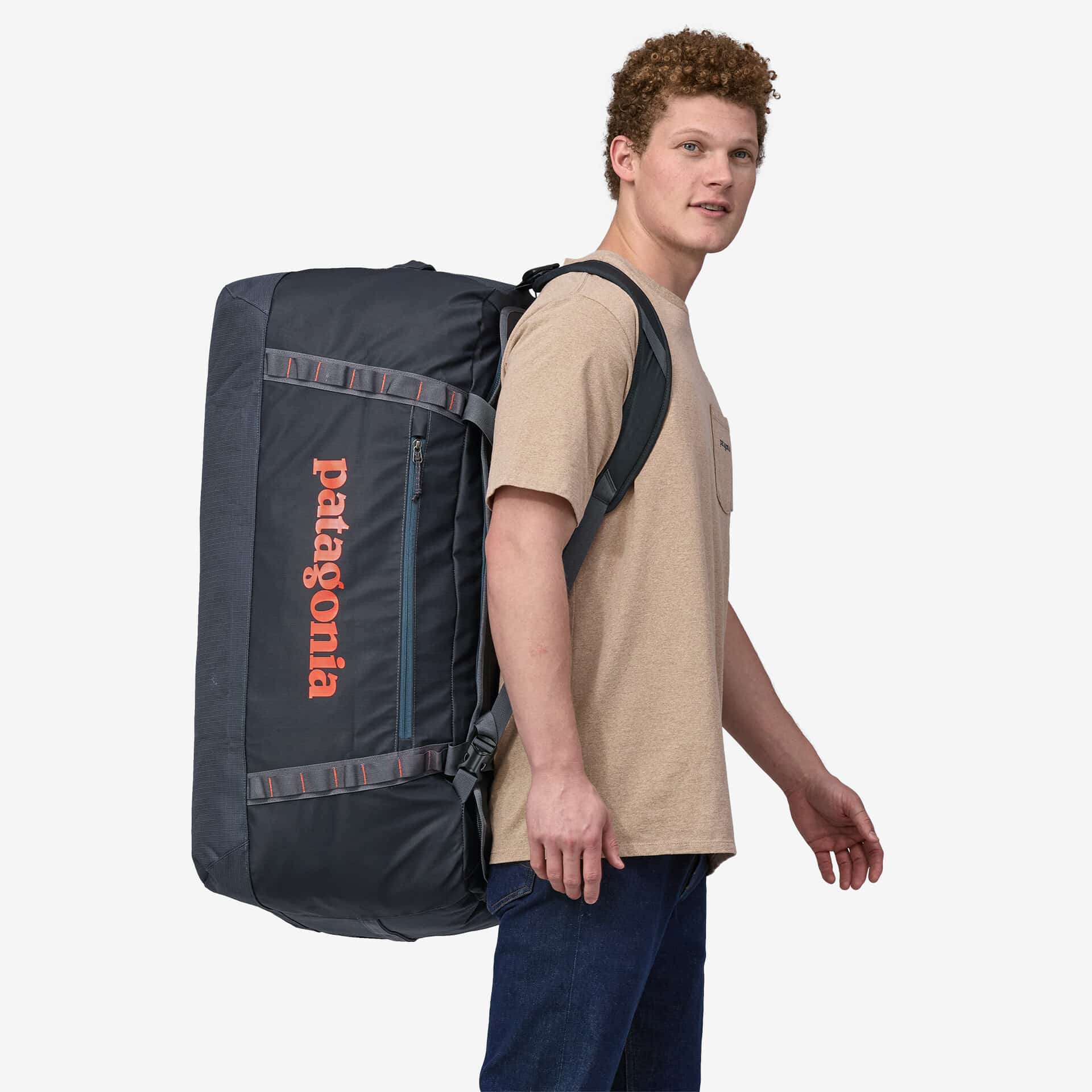 An image of person wearing the Patagonia Black Hole Duffel 100l on their back.