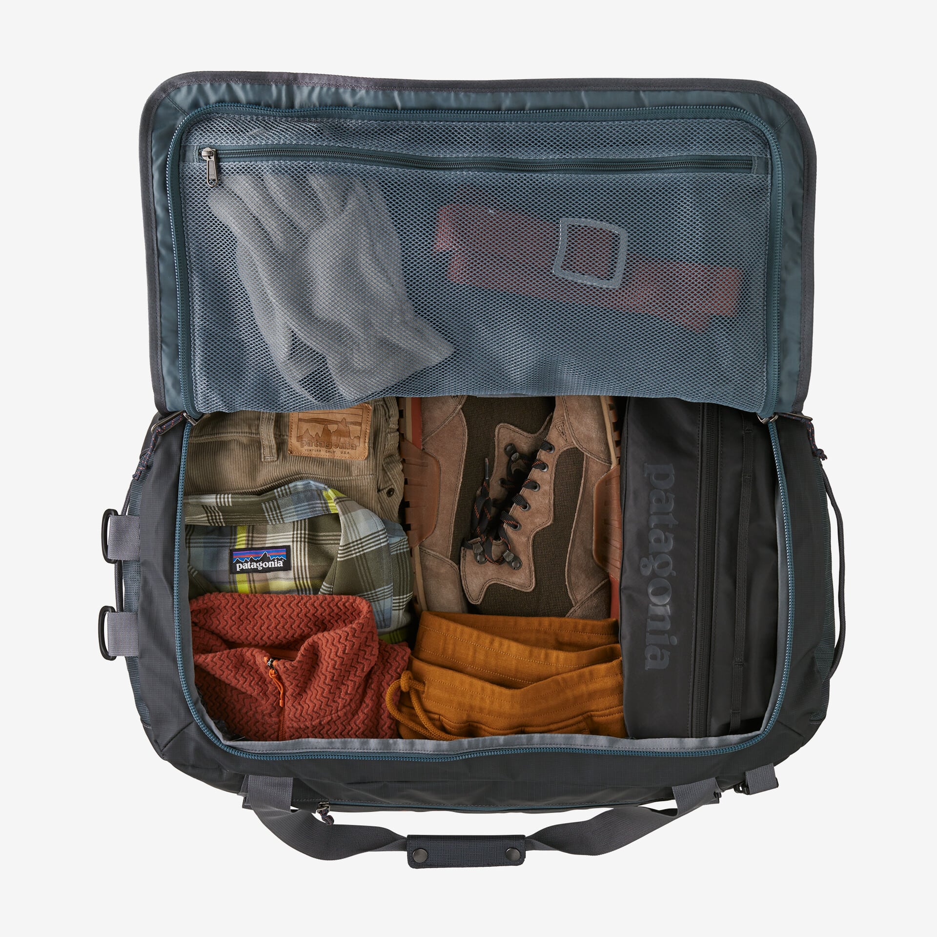 A Patagonia Black Hole duffel 55L zipped open