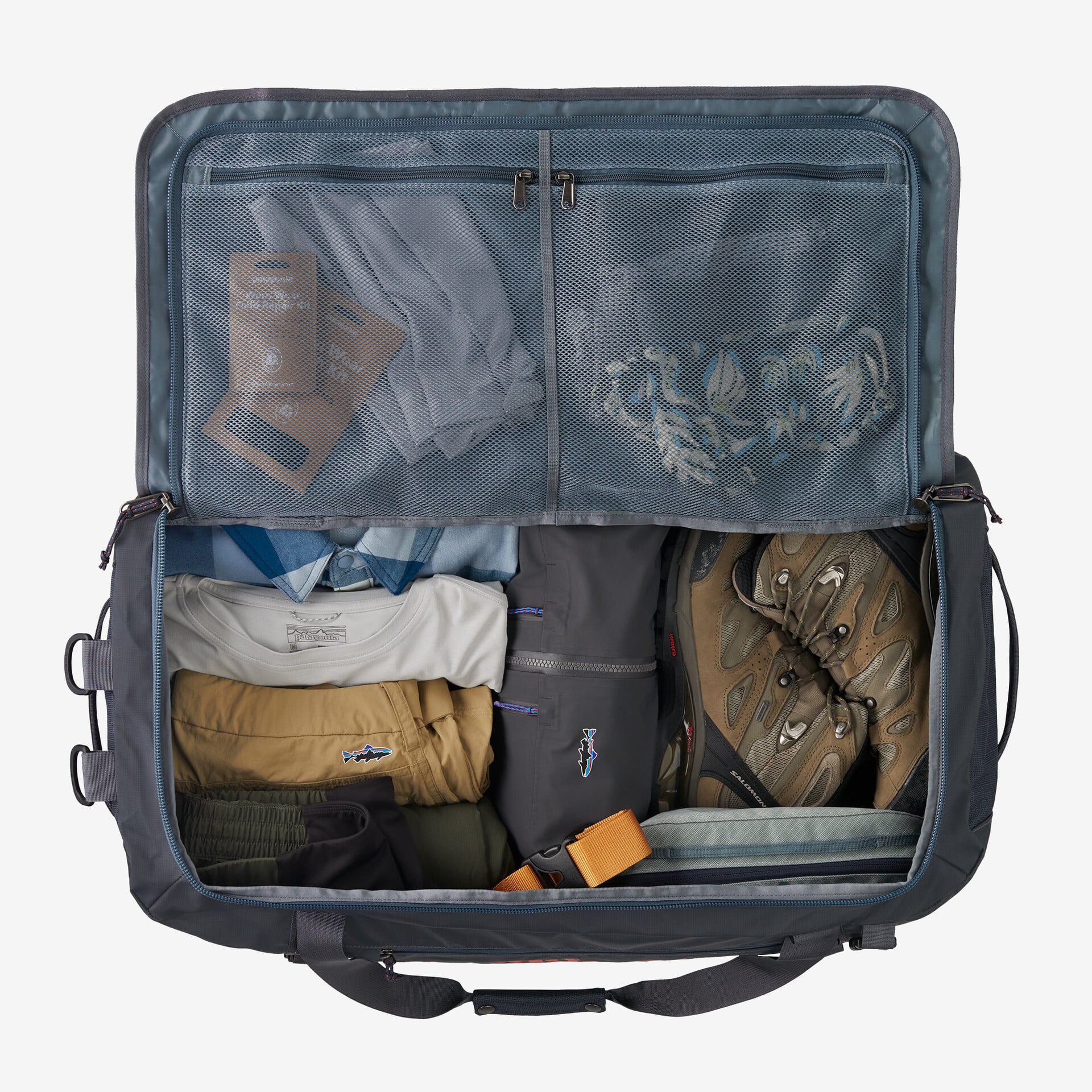 A Patagonia Black Hole duffel 70L zipped open.