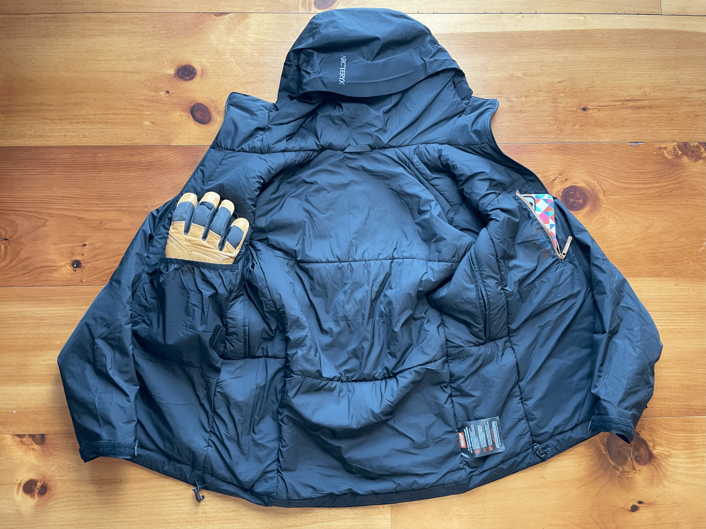 The interior of the Arc'teryx Beta Insulated jacket showing pockets.