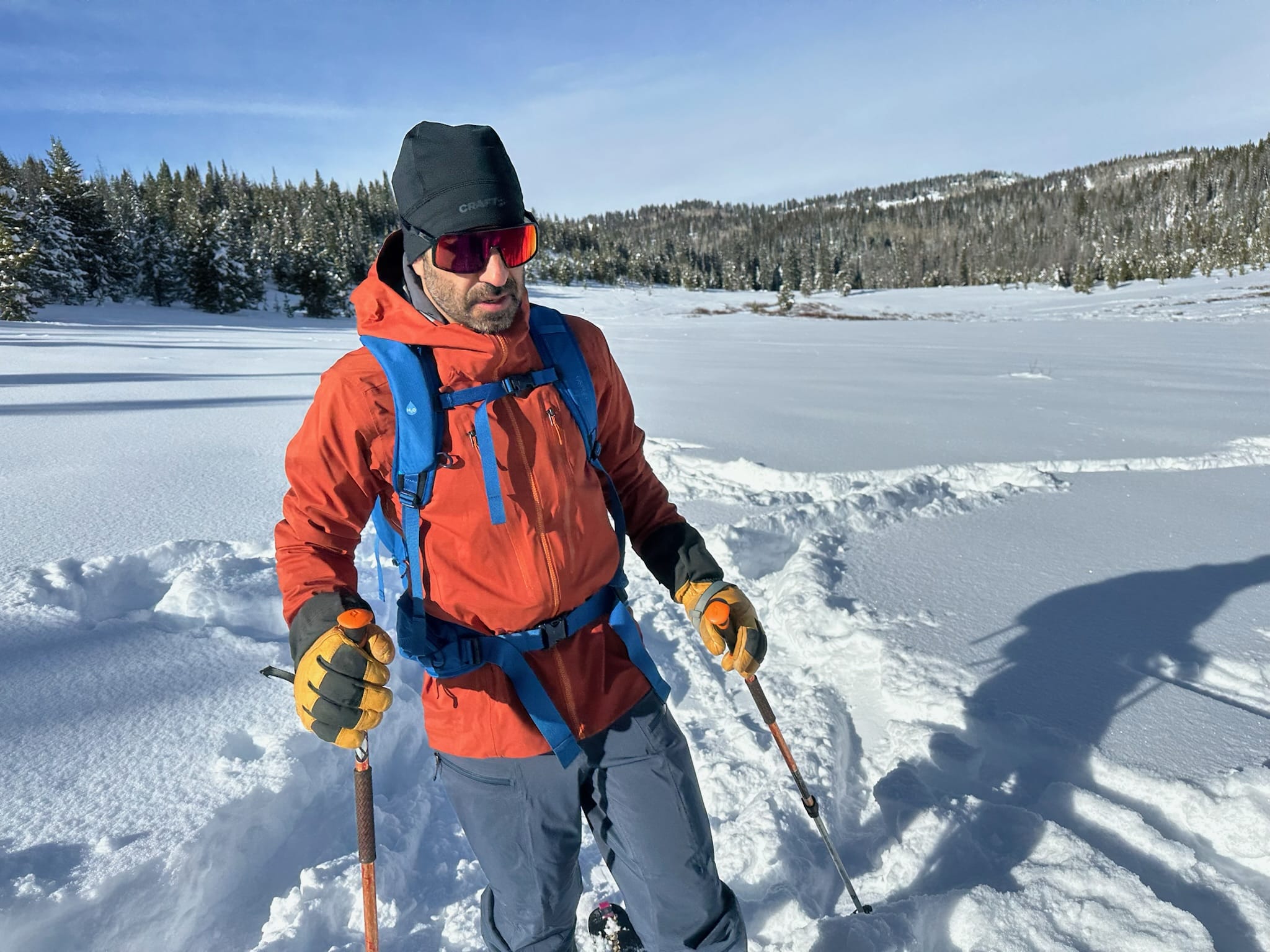 Wearing the Patagonia Stormstride backcountry ski jacket with a backpack.