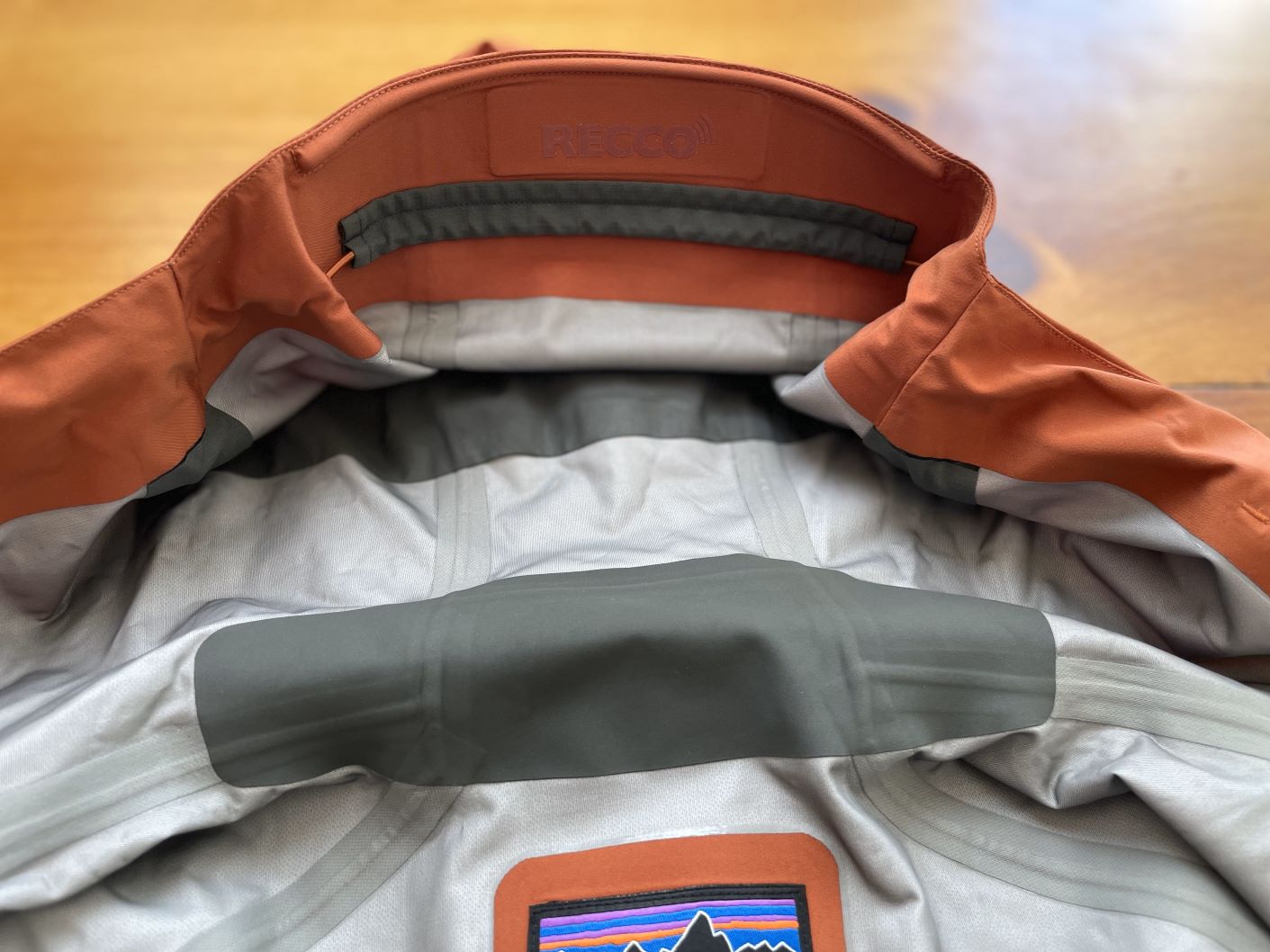 The recco reflector on the underside of the hood on a Patagonia Stormstride jacket