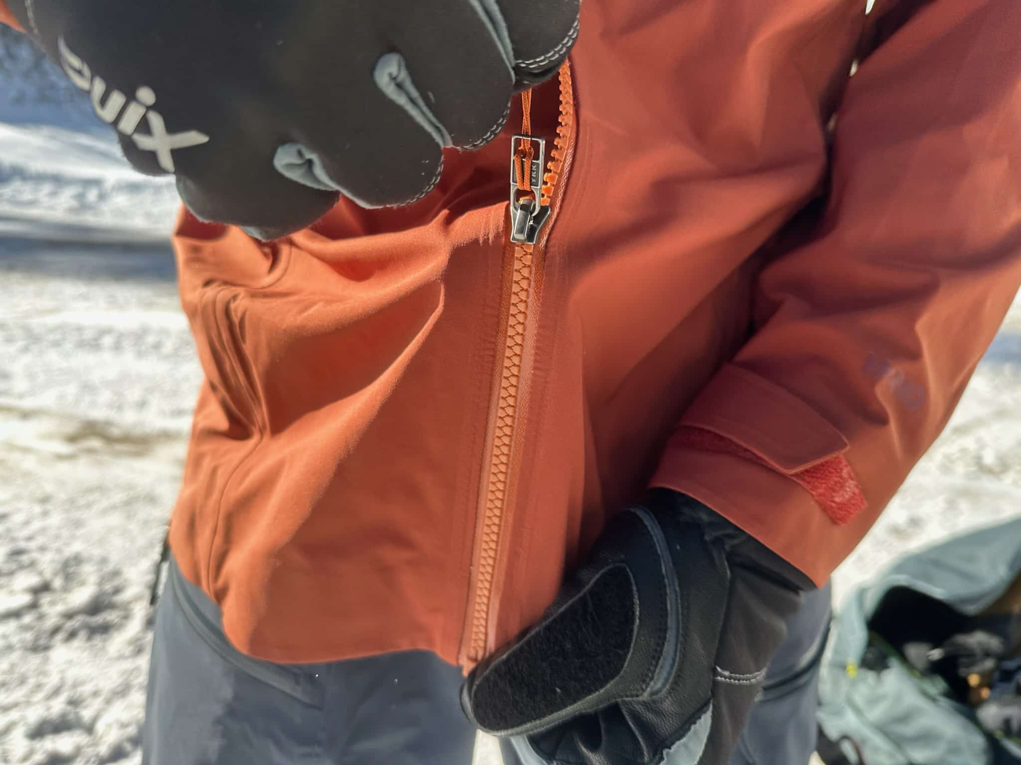 The main zipper on the Patagonia Stormstride backcountry ski jacket.