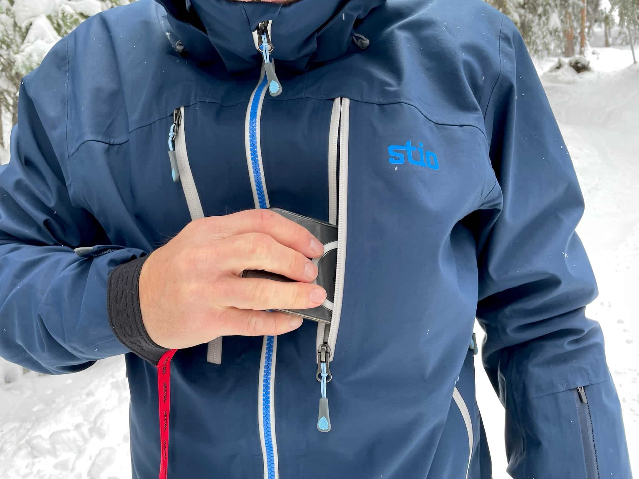 The Stio Environ Jacket's external zippered chest pocket easily fits a phone