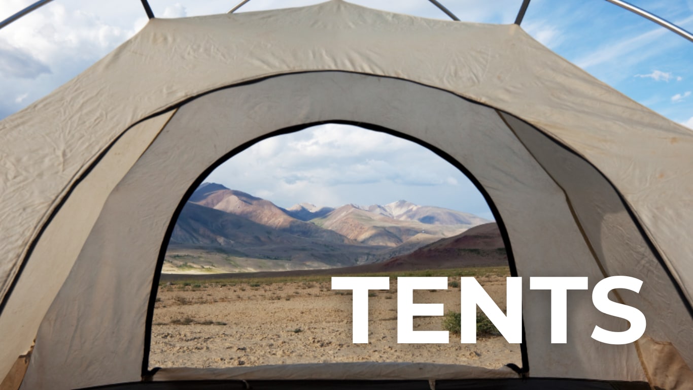 Looking out a camping tent door at mountains.