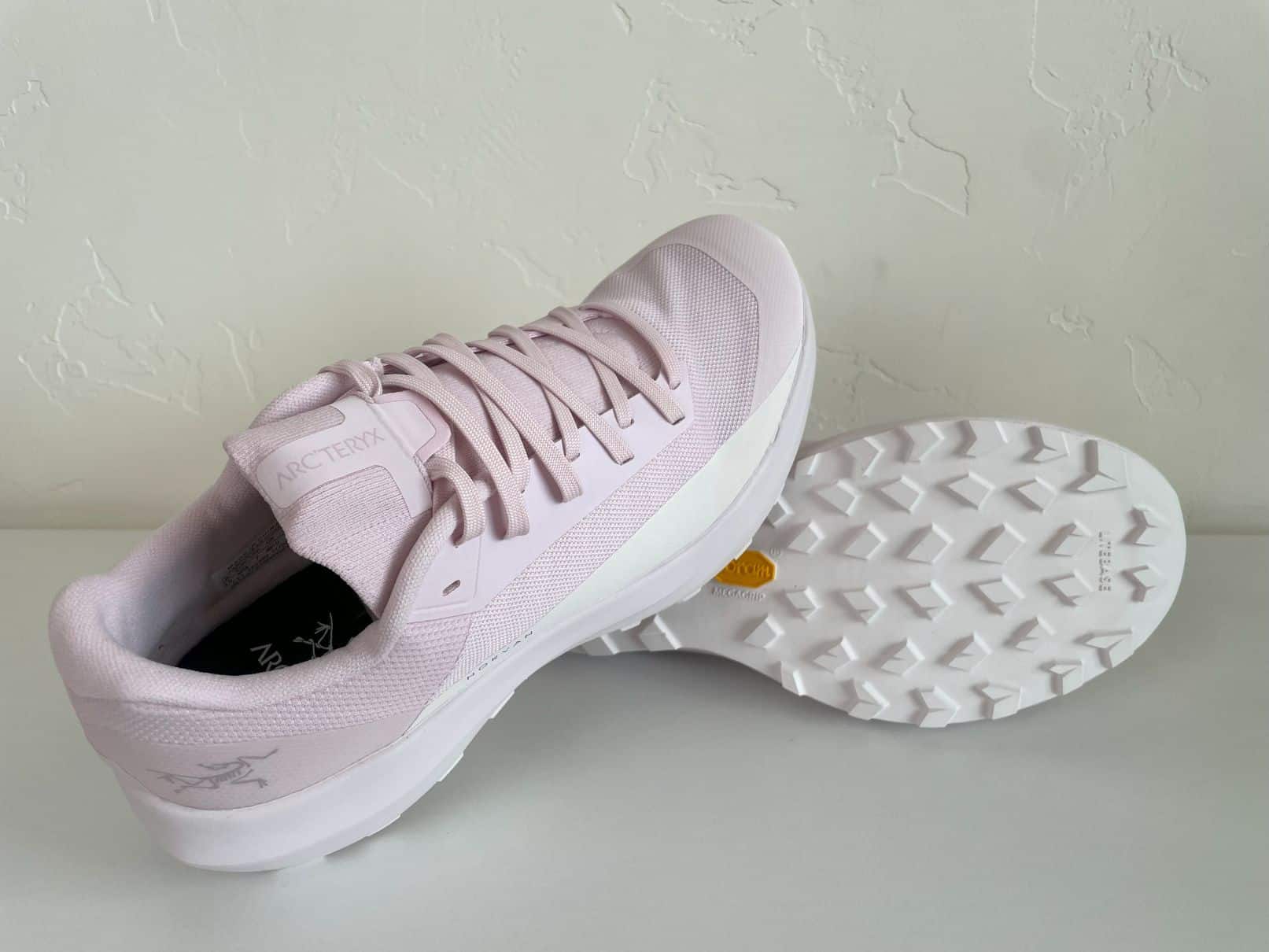 A pair of women's Arc'teryx Norvan 4 trail running shoes.