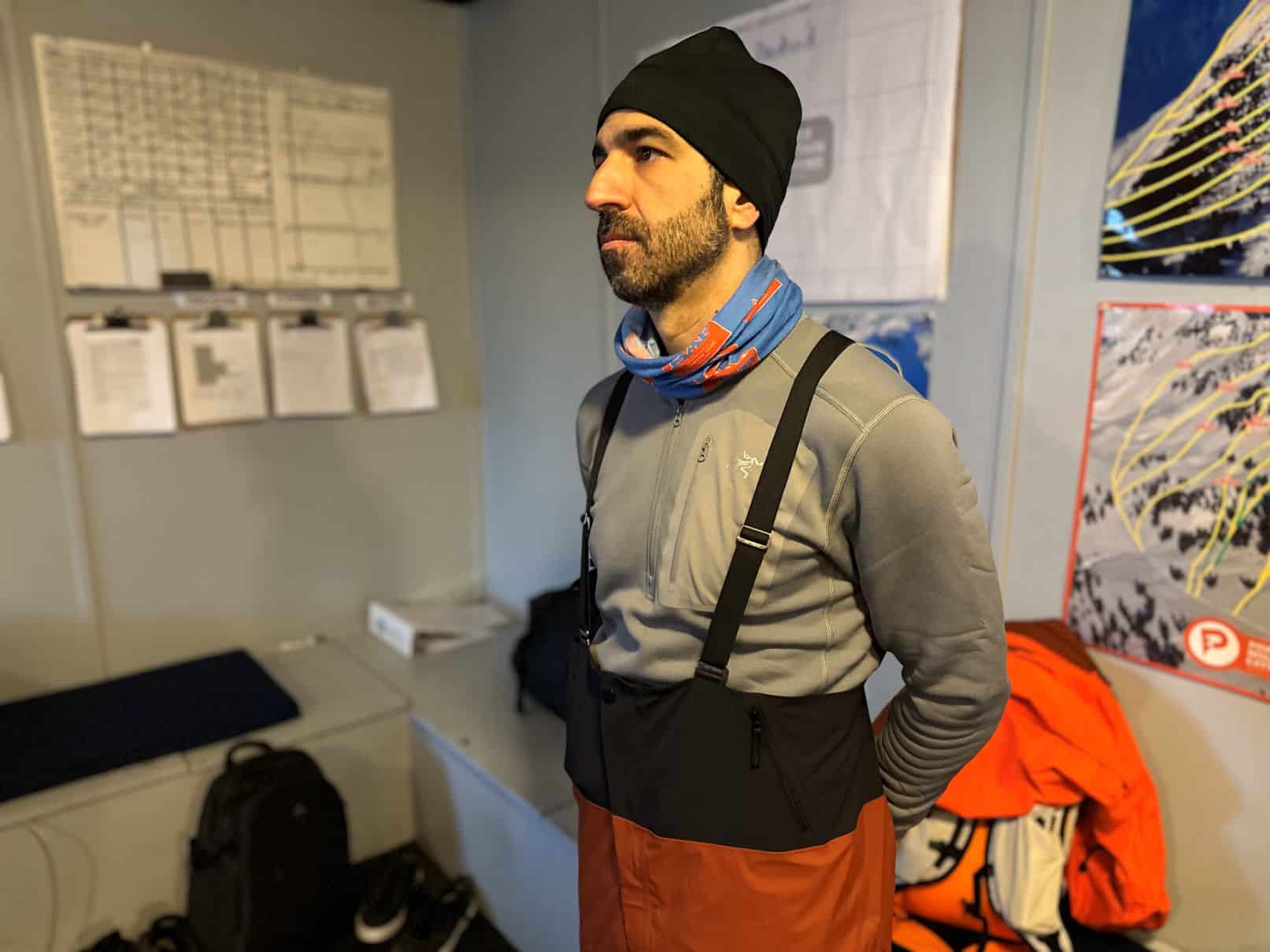 Skier standing in the Arc'teryx Rush Bib Pant.