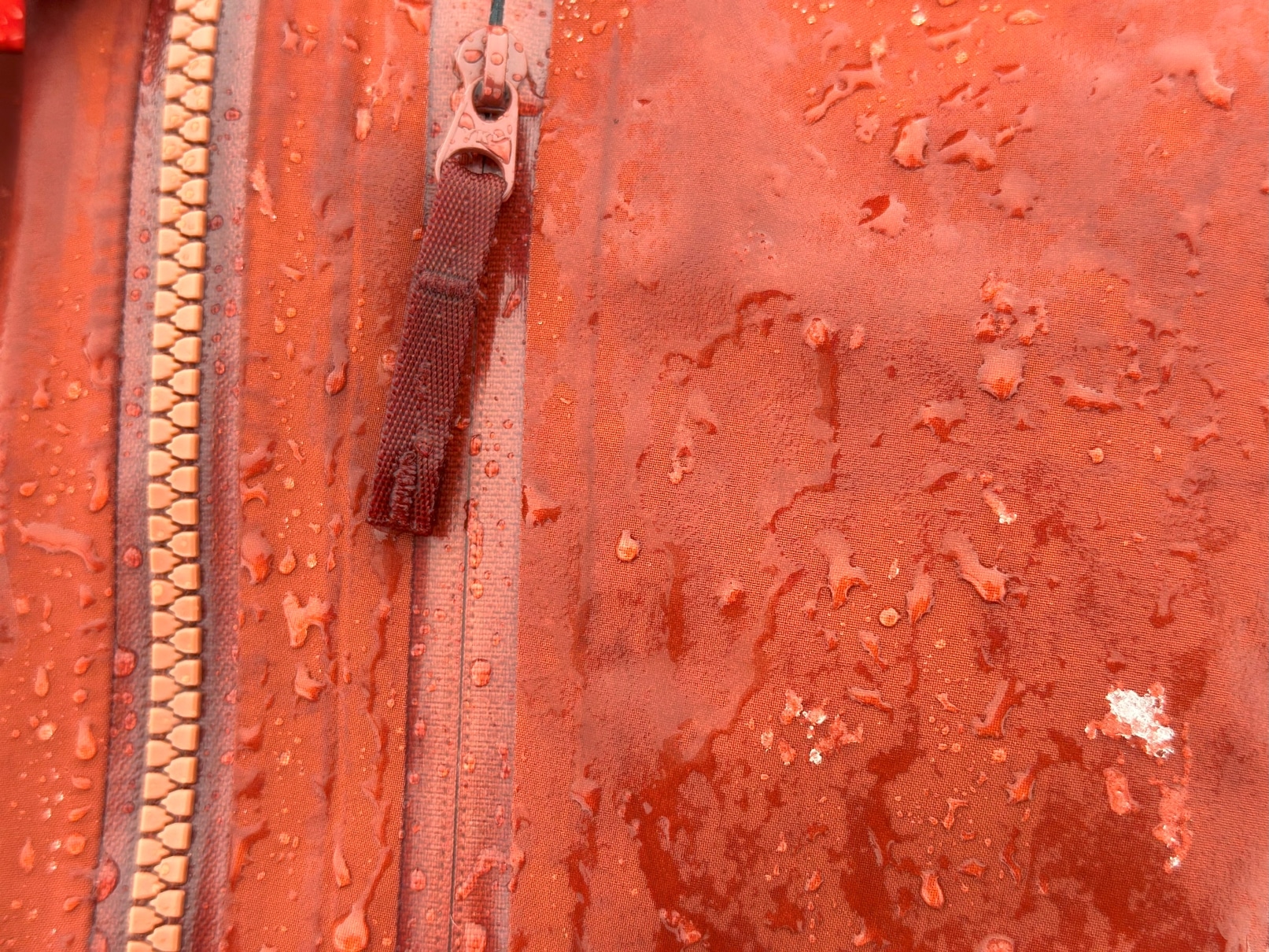 A closeup image showing the face fabric wetting out on an Arct'teryx Rush jacket