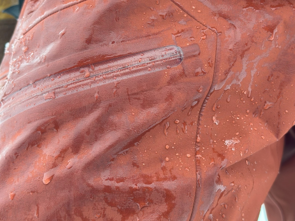 A closeup image of the Arc'teryx Rush ski pants showing water on the face fabric.