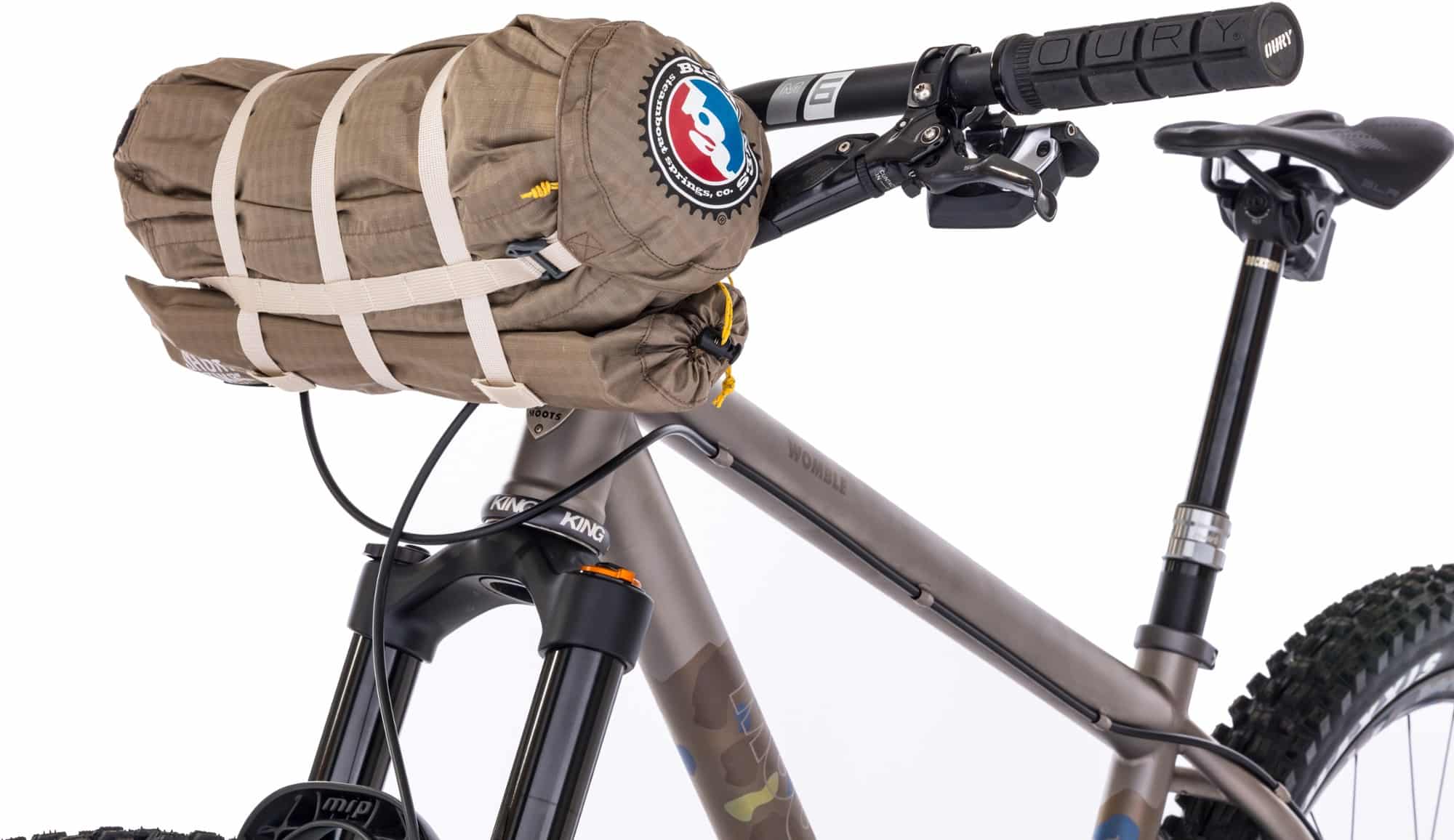 A Big Agnes Fly Creek UL1 Bikepack ultralight tent mounted on the handlebar of a mountain bike.