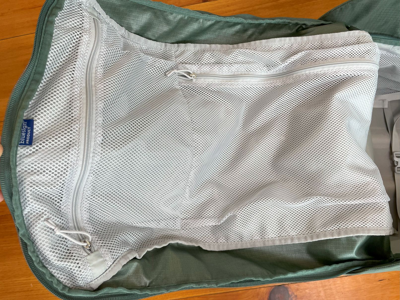 The pockets on the underside of the lid on the Osprey Sojourn Shuttle 100L travel duffel.