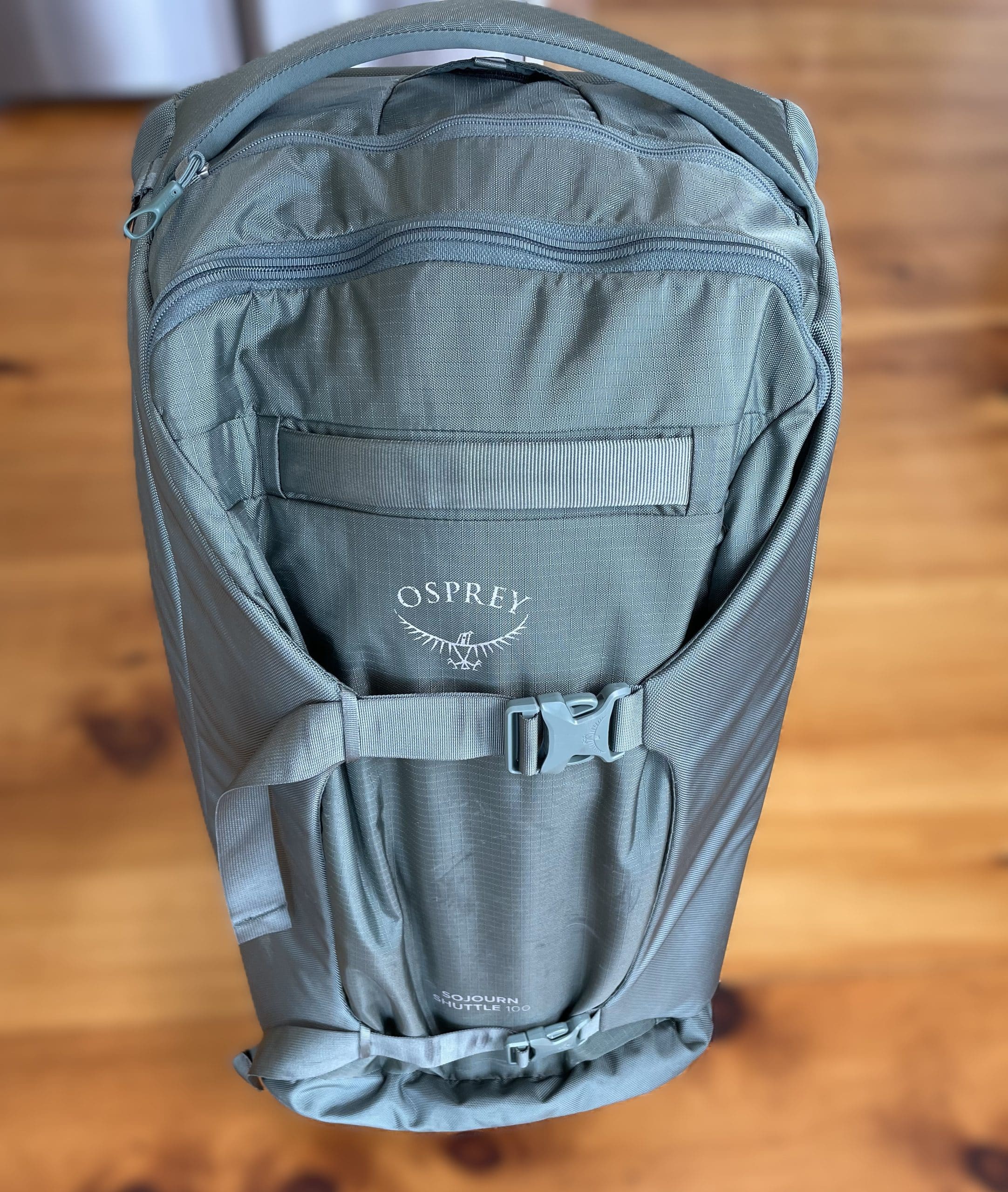 The Osprey Sojourn Shuttle 100L travel duffel standing upright.
