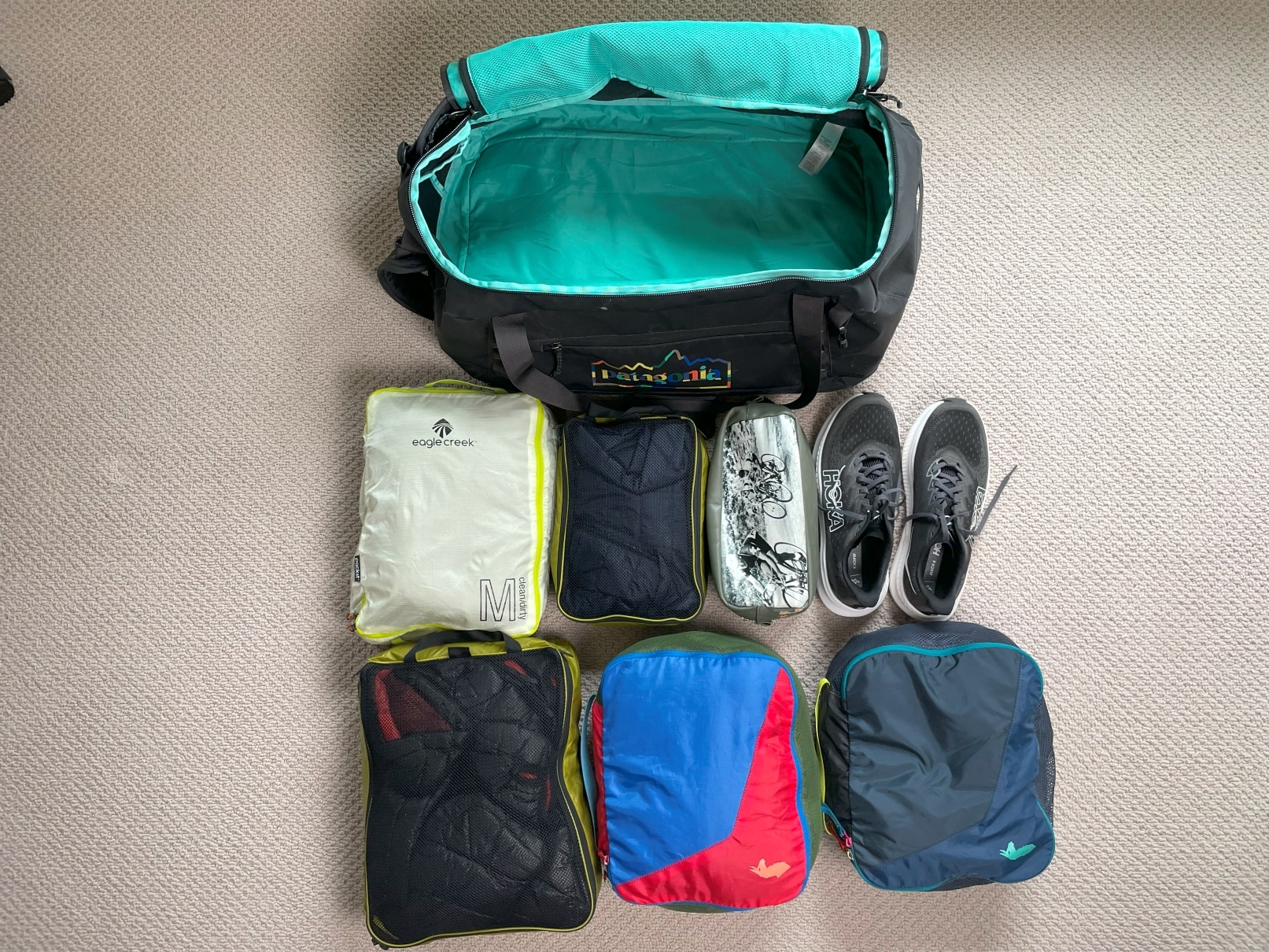 The Patagonia Black Hole Duffel 55L along with contents that can be packed inside.