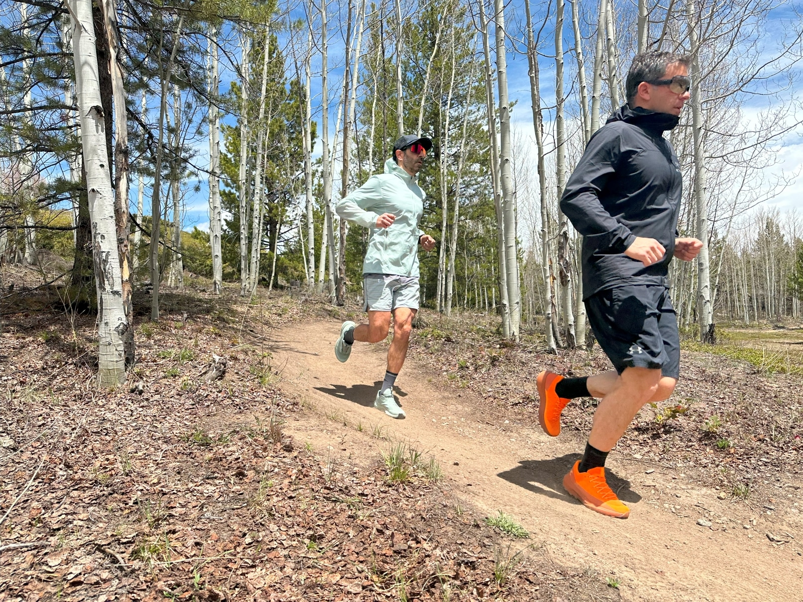 Two trail runners using the Arc'teryx Norvan 4 trail running shoe.