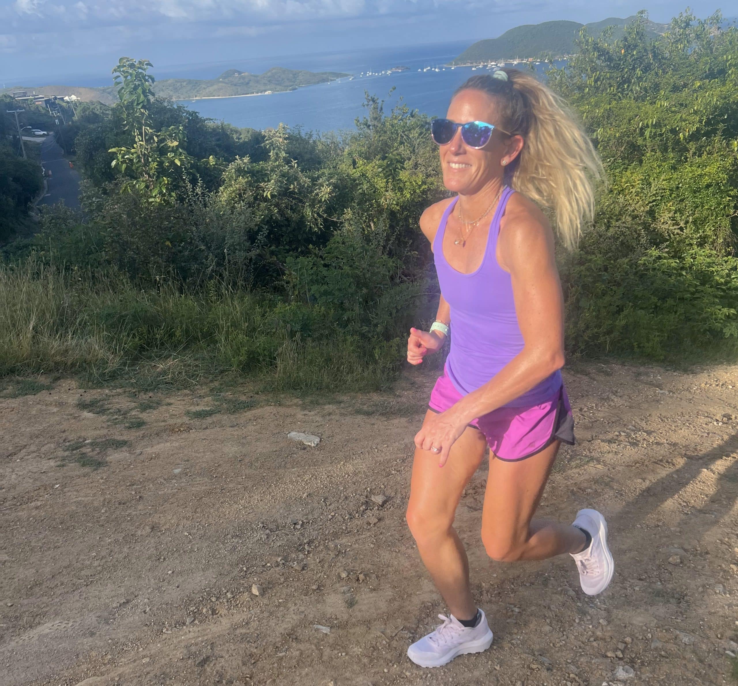 A woman running in the Arc'teryx Norvan 4 trail running shoe.