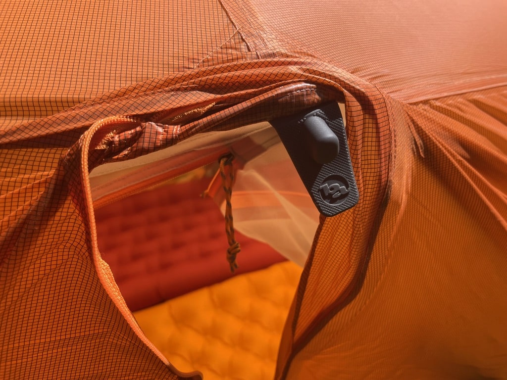 Closeup image of the crossover pole cap attachment on the rain fly of the Big Agnes Copper Spur UL2 tent.