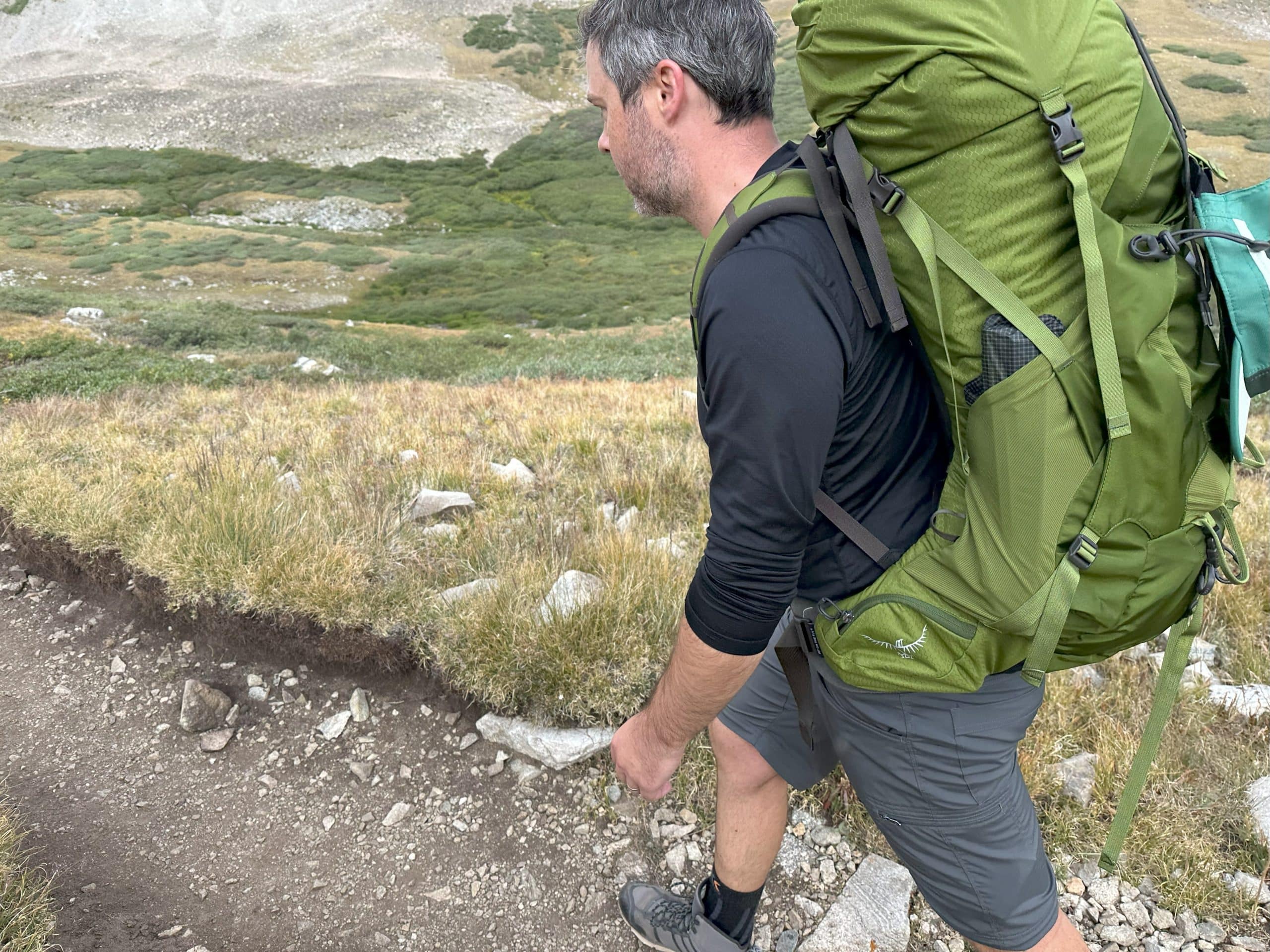 Image showing the side stretch and hip belt pockets on the Osprey Aether 55 backpack.