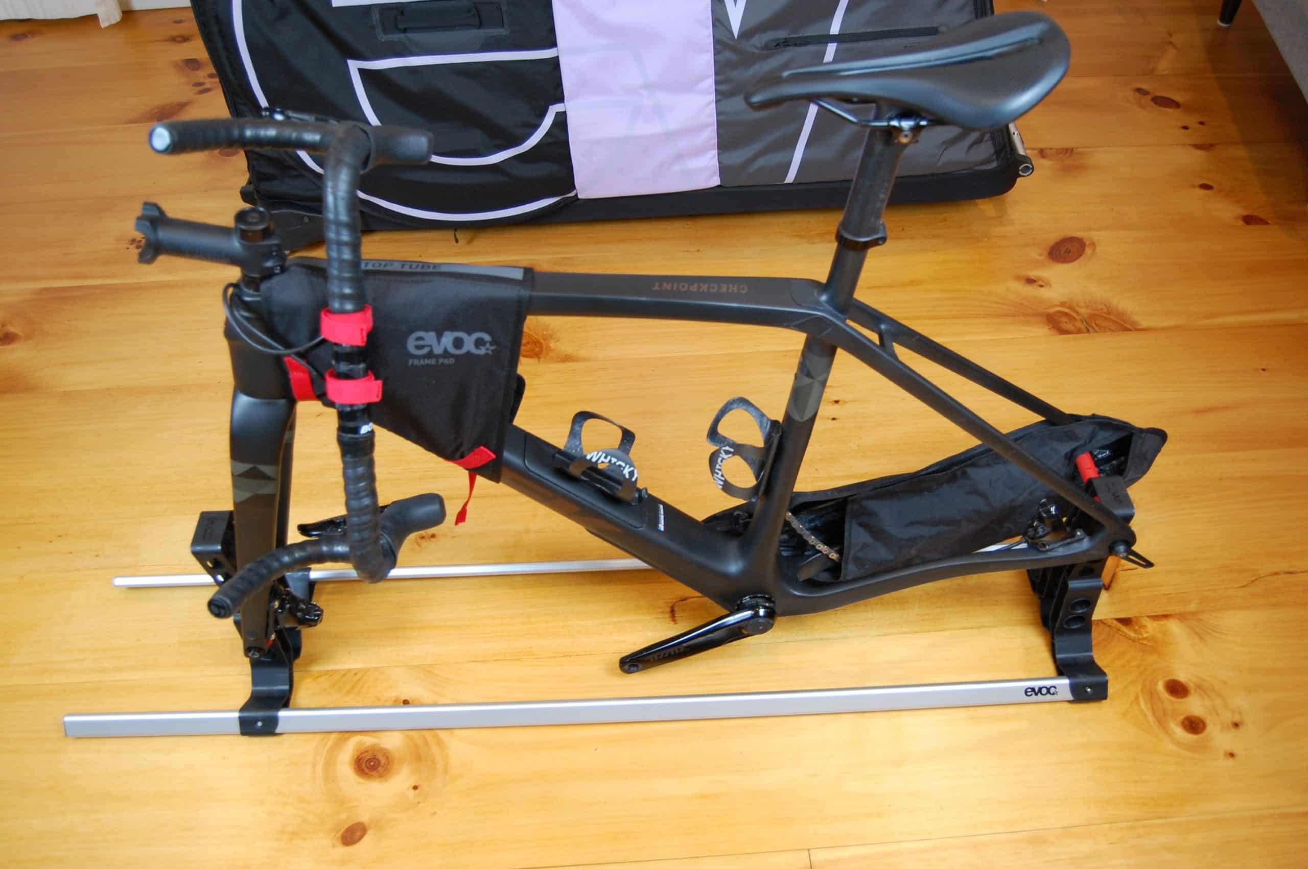 A gravel bike on the Evoc bike stand pro for packing in the Evoc Travel Bag Pro.