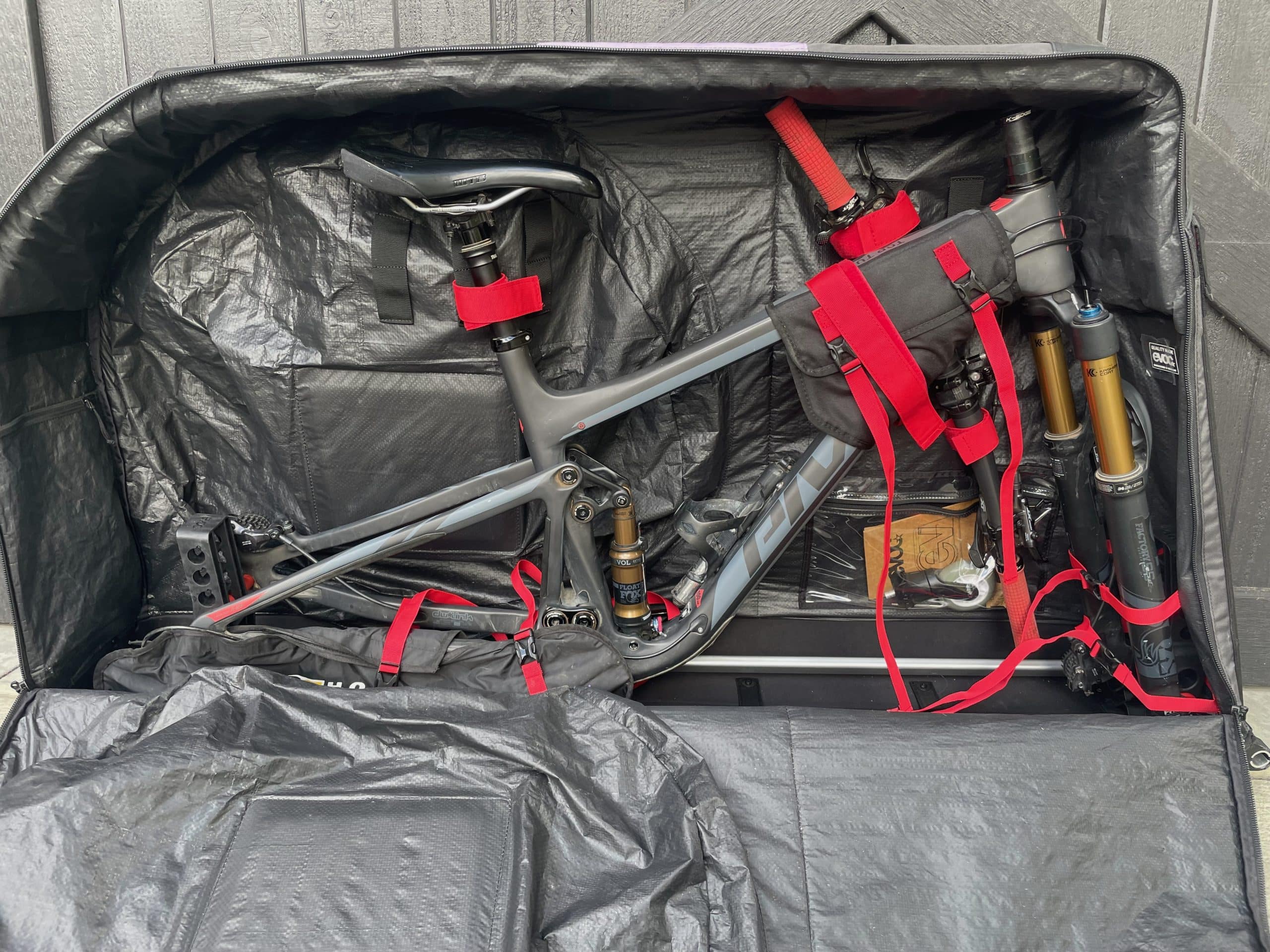 A mountain bike packed in the Evoc Travel Bag Pro.