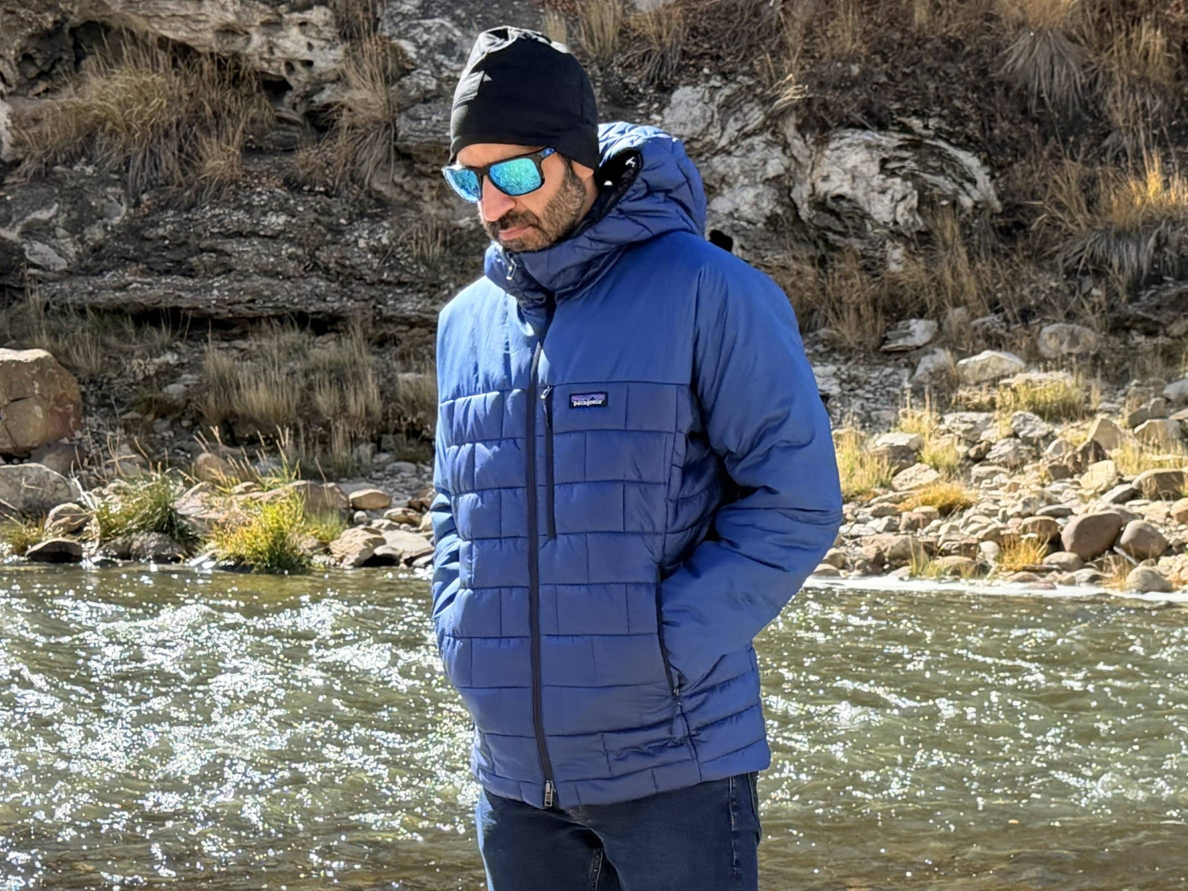 A man wearing the Patagonia Hi-Loft Nano Puff Hoody in Clement Blue.