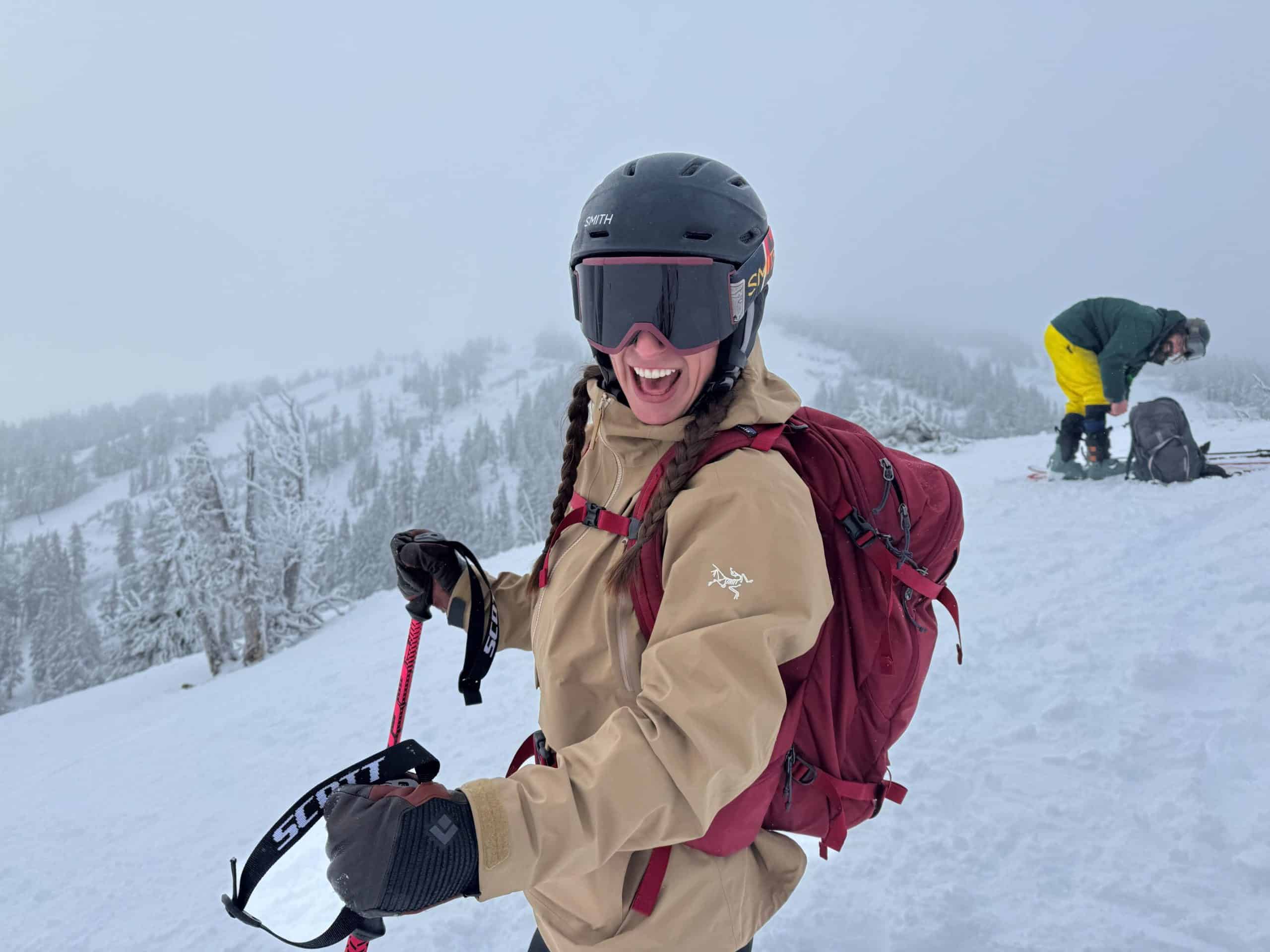 A skier getting ready to ski her line in the backcountry while wearing the Arc'teryx Liatris jacket.