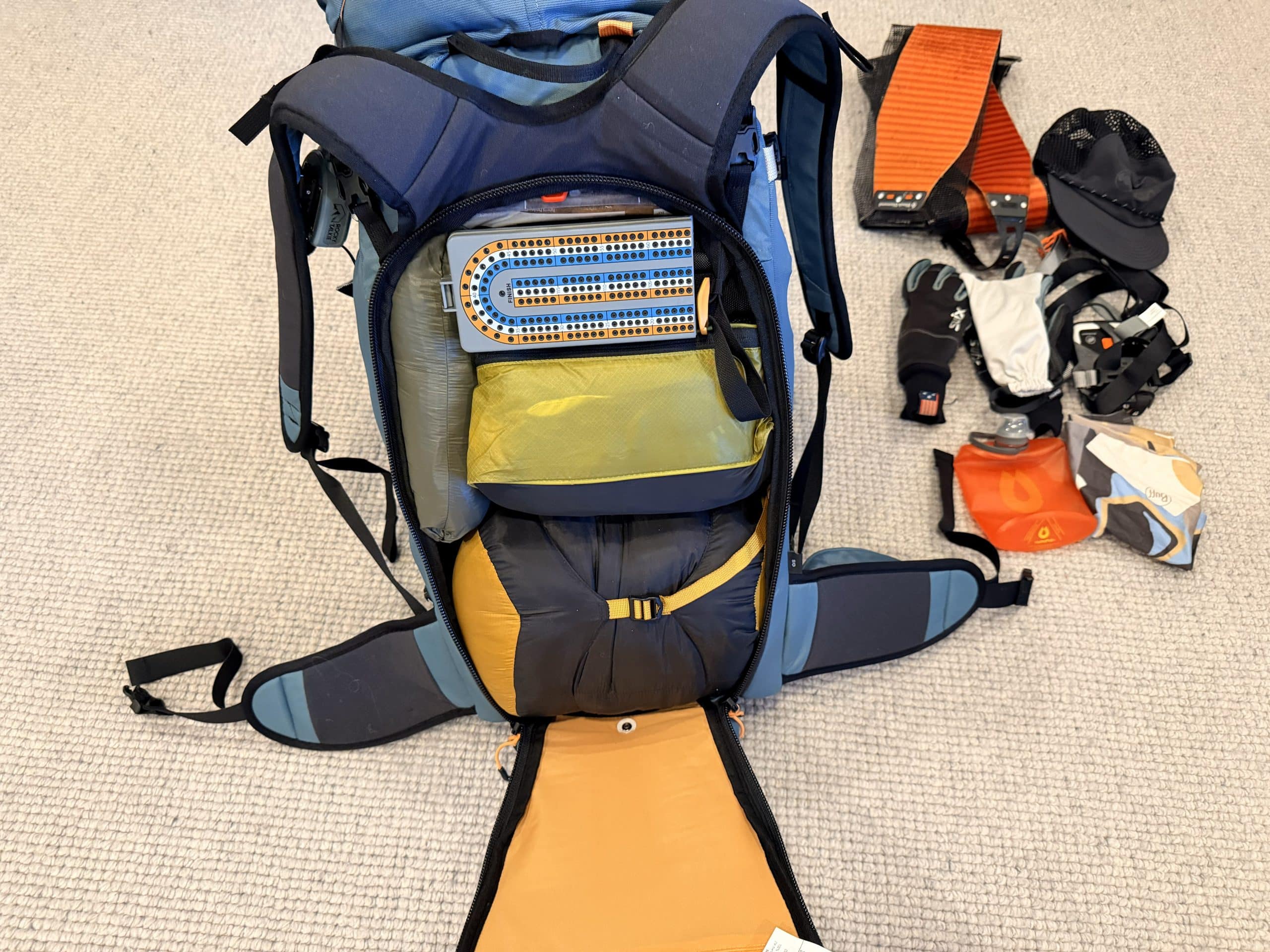The main compartment of a fully packed Osprey Soulden 45L ski backpack.